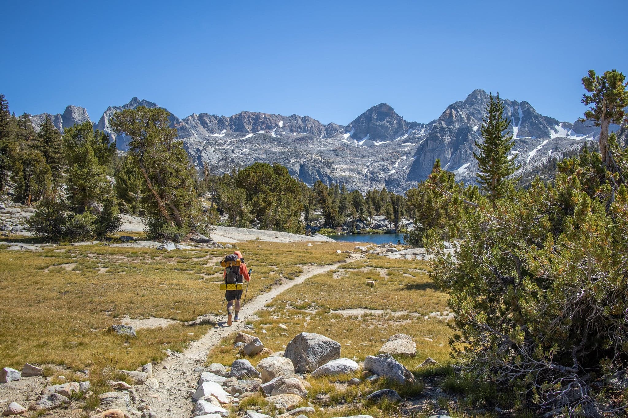 Hiker approaching Rae Lakes

Photo by Bridget Houchins